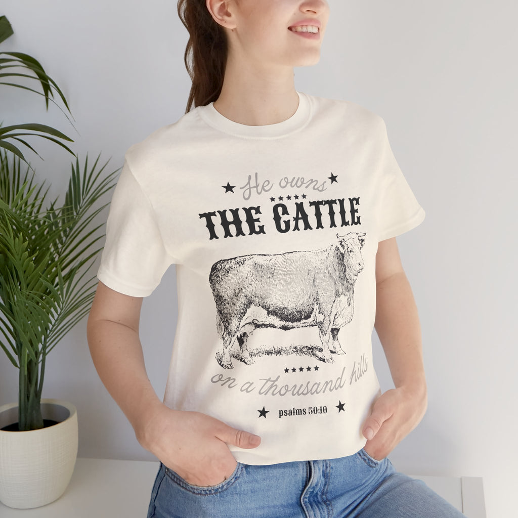 Vintage Cow Graphic Tee — "He Owns The Cattle" Rustic Farm Shirt (Psalm 50:10)