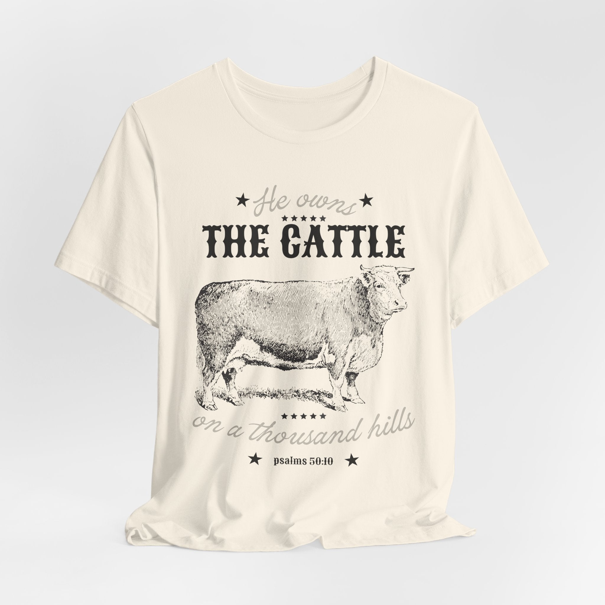 Vintage Cow Graphic Tee — "He Owns The Cattle" Rustic Farm Shirt (Psalm 50:10)